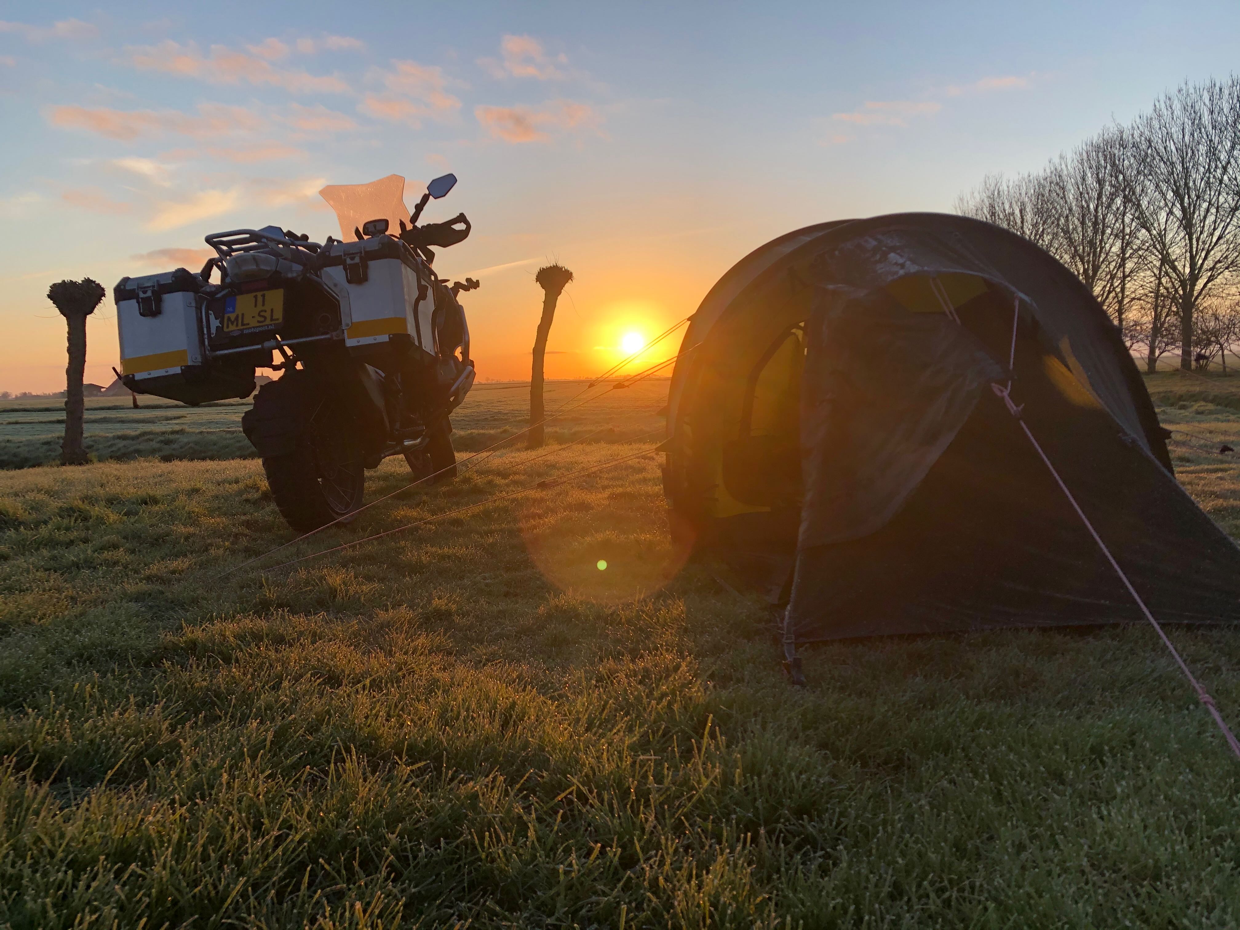 Herko's motorcycle and tent during sunrise